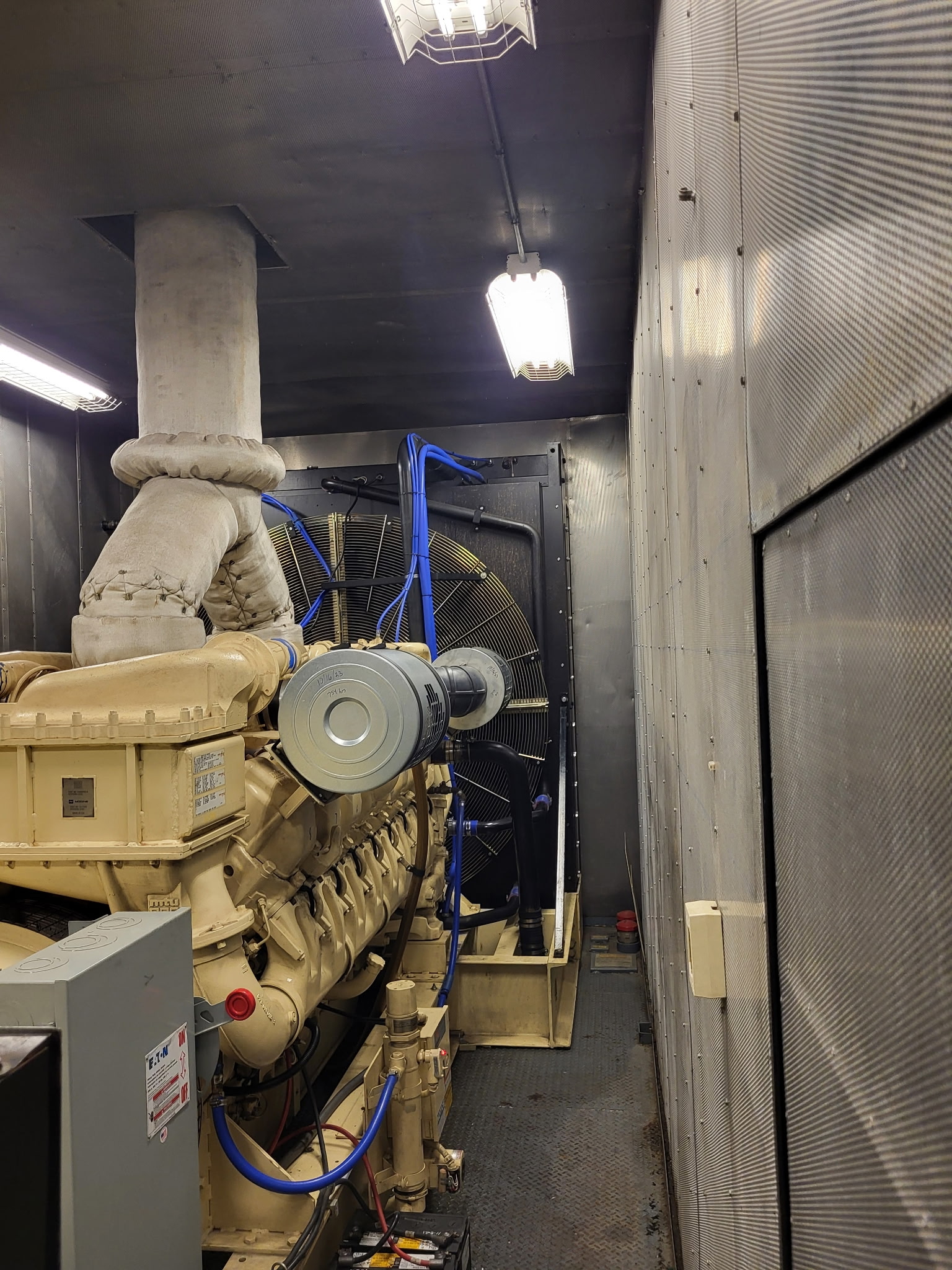 Large standby diesel generator with its radiator cooling package