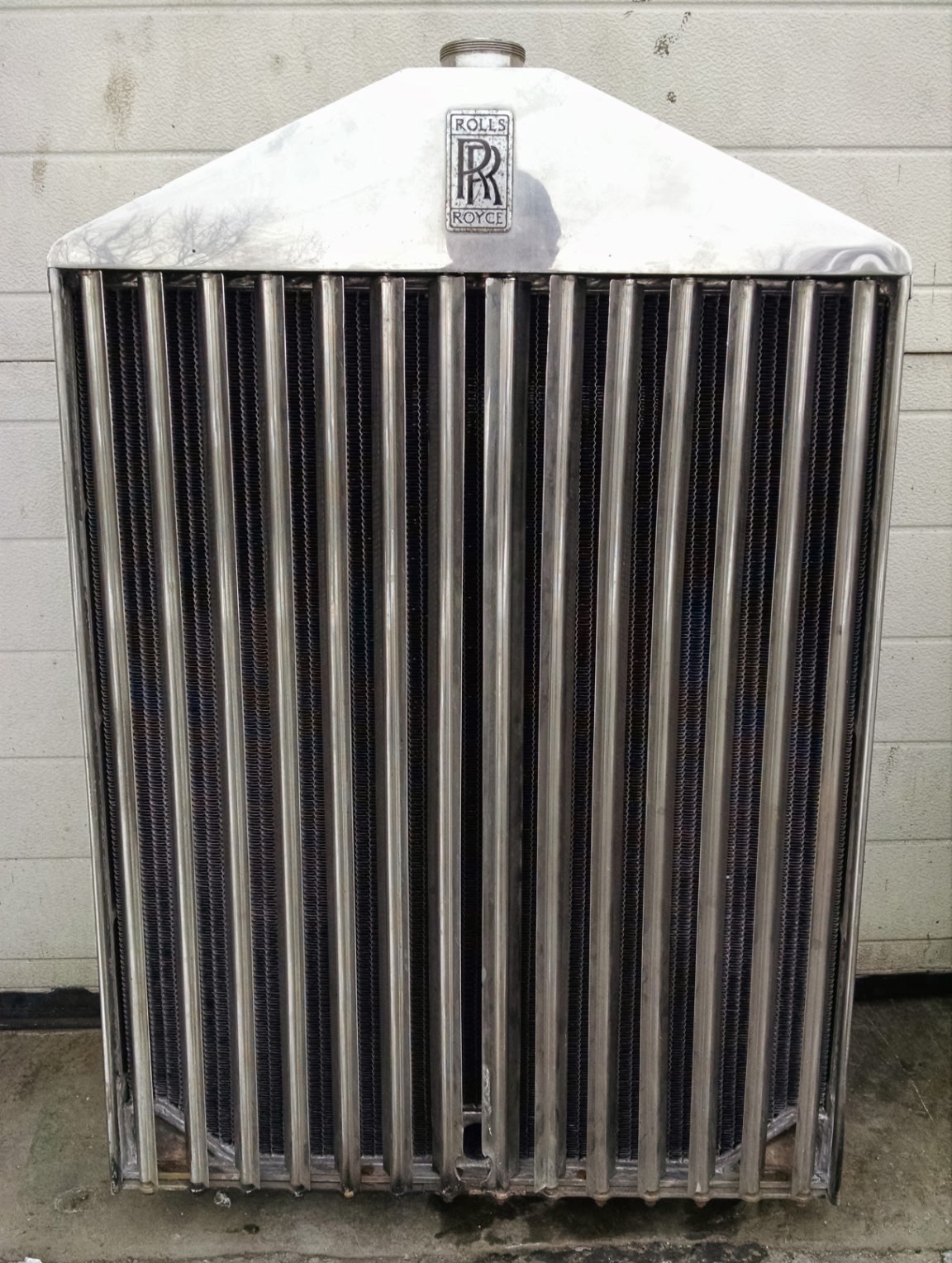 Restored Rolls-Royce radiator shell with a freshly installed core
