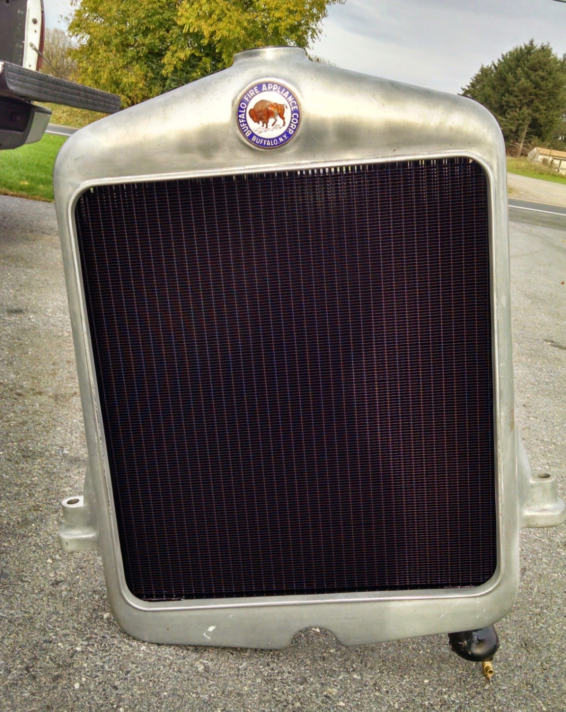 Freshly recored vintage Buffalo Fire Appliance Corp radiator in its polished aluminum shell, restored at Melcot Radiator